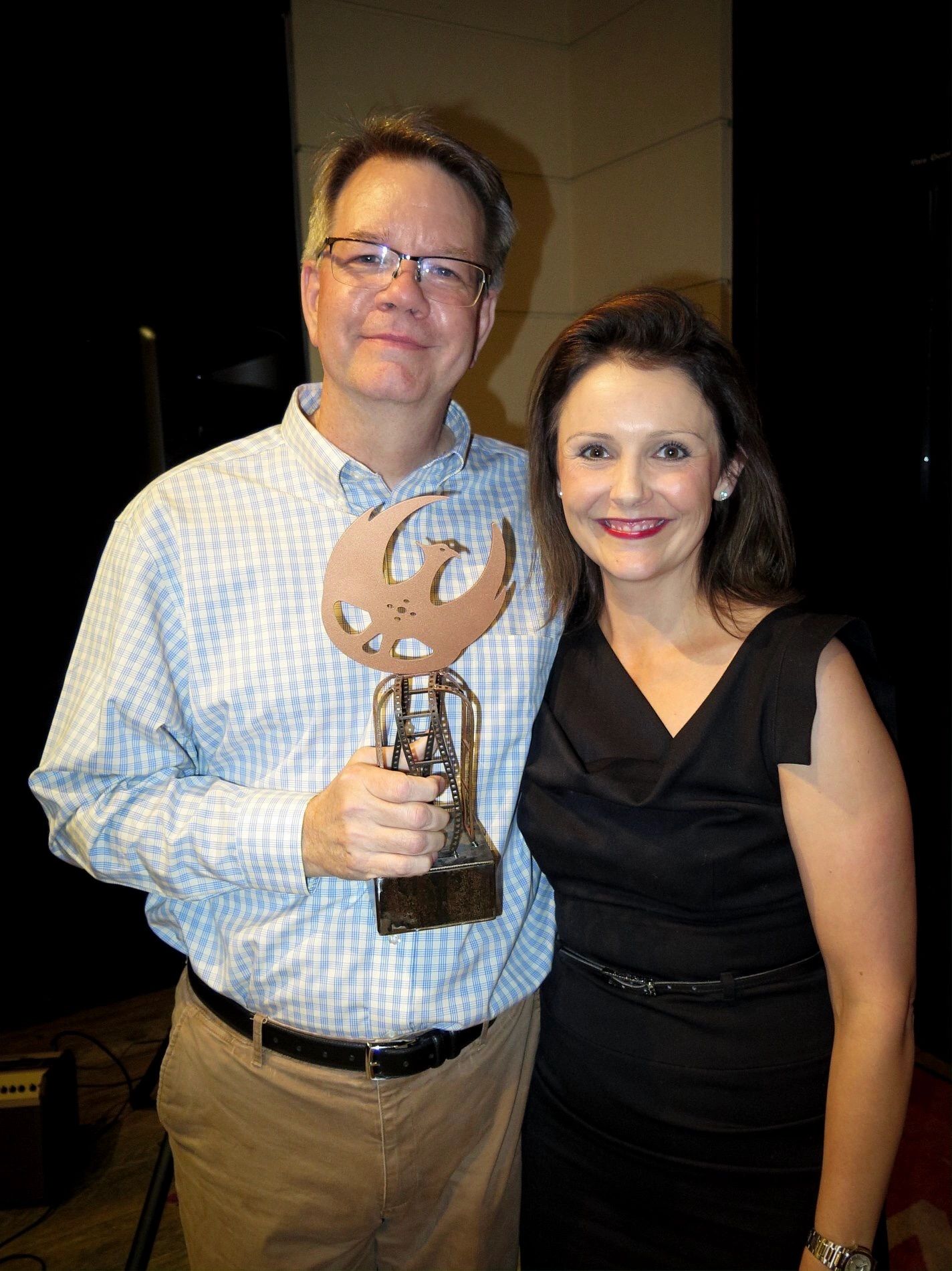 Bruce Dellis and Amanda Melby accept the Copper Wing for Best Arizona Feature